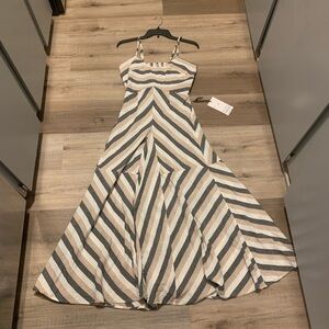 Stripped maxi dress with adjustable straps. Brand new with tags.